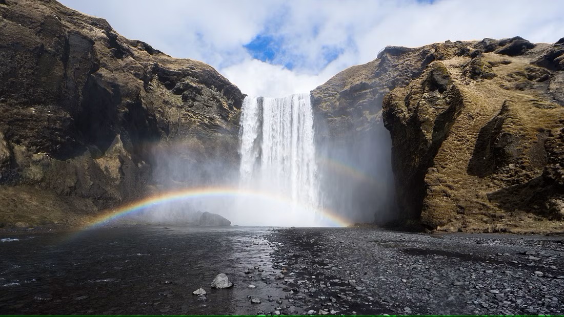 cascada costa sur arcoiris naturaleza islandia